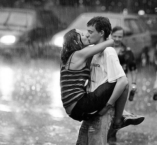 Romantic Kiss for New Year's Eve in the Rain