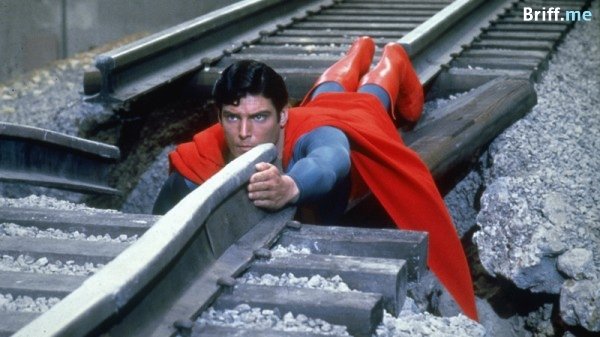 Work Pressure - Superman holding railroad