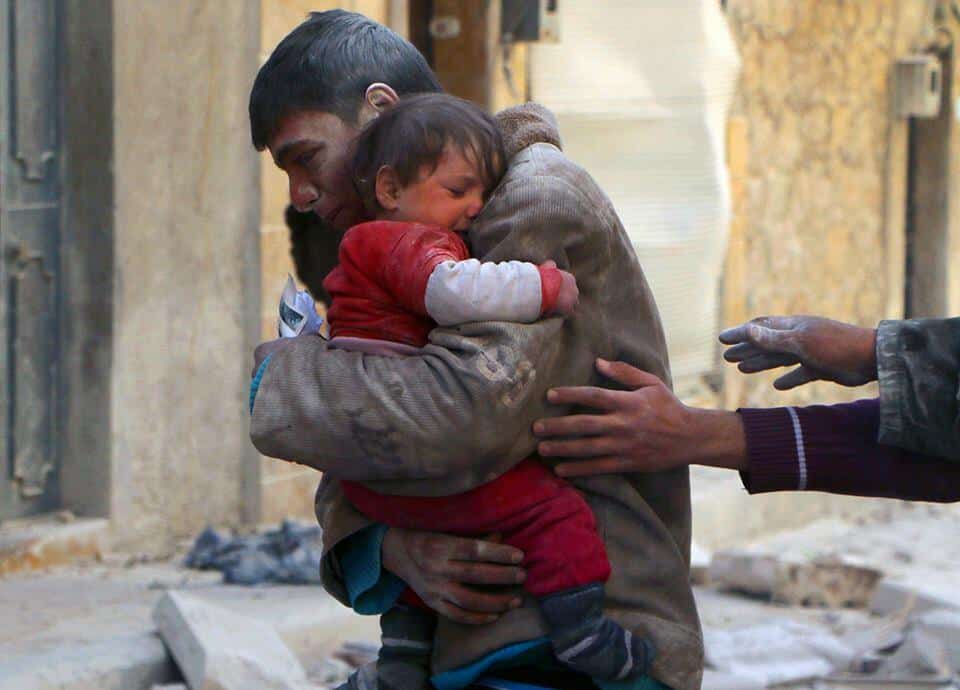 A boy rescues his sister from underneath the rubble of their home in Syria Human Diversity