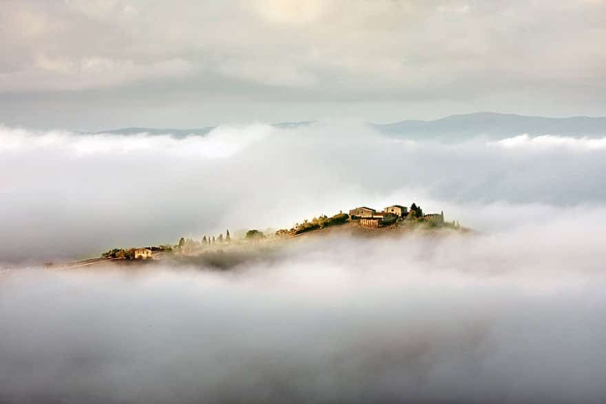 Between clouds and mists Tuscany – Italy Misty Village