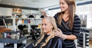 female getting hair treatment in the salon
